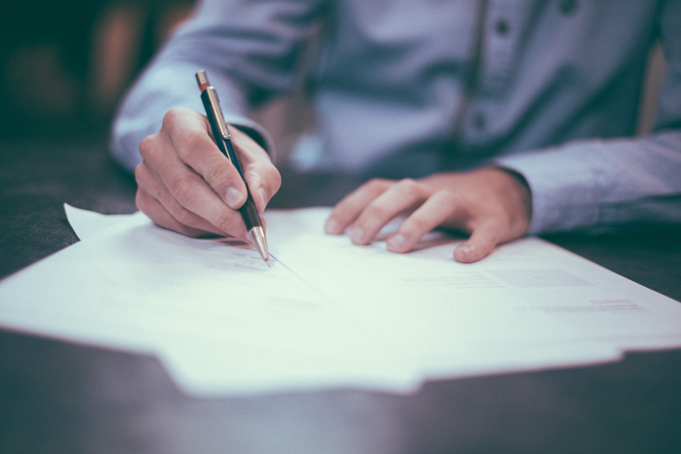 Professional signing an organisation document